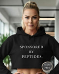 Sponsored by Peptides Cropped Hoodie — White Feminine Fitness Sweatshirt